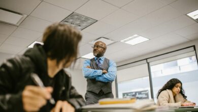 teacher proctoring his students during an examination